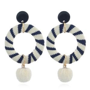 Striped hoops with white pompom earrings
